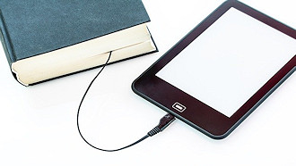 tablet attached to book